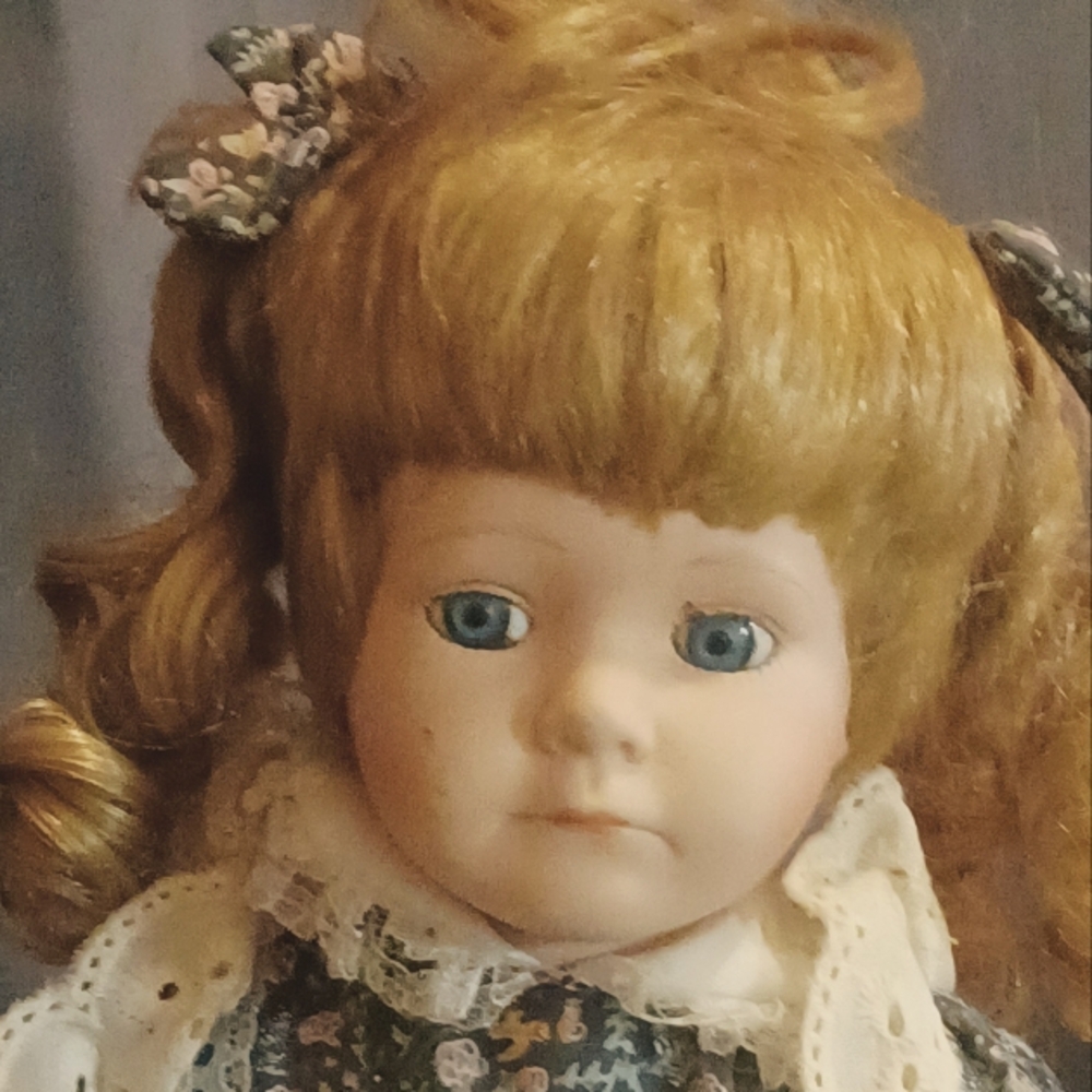 Vintage Porcelain Doll with Blue Eyes